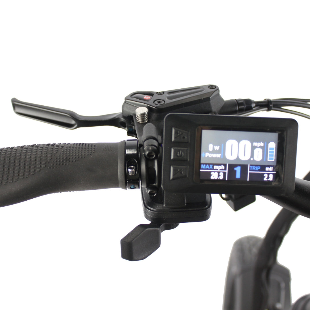Close-up of an e-bike handlebar with a textured grip, brake lever, thumb throttle, and an illuminated digital LCD speedometer screen.