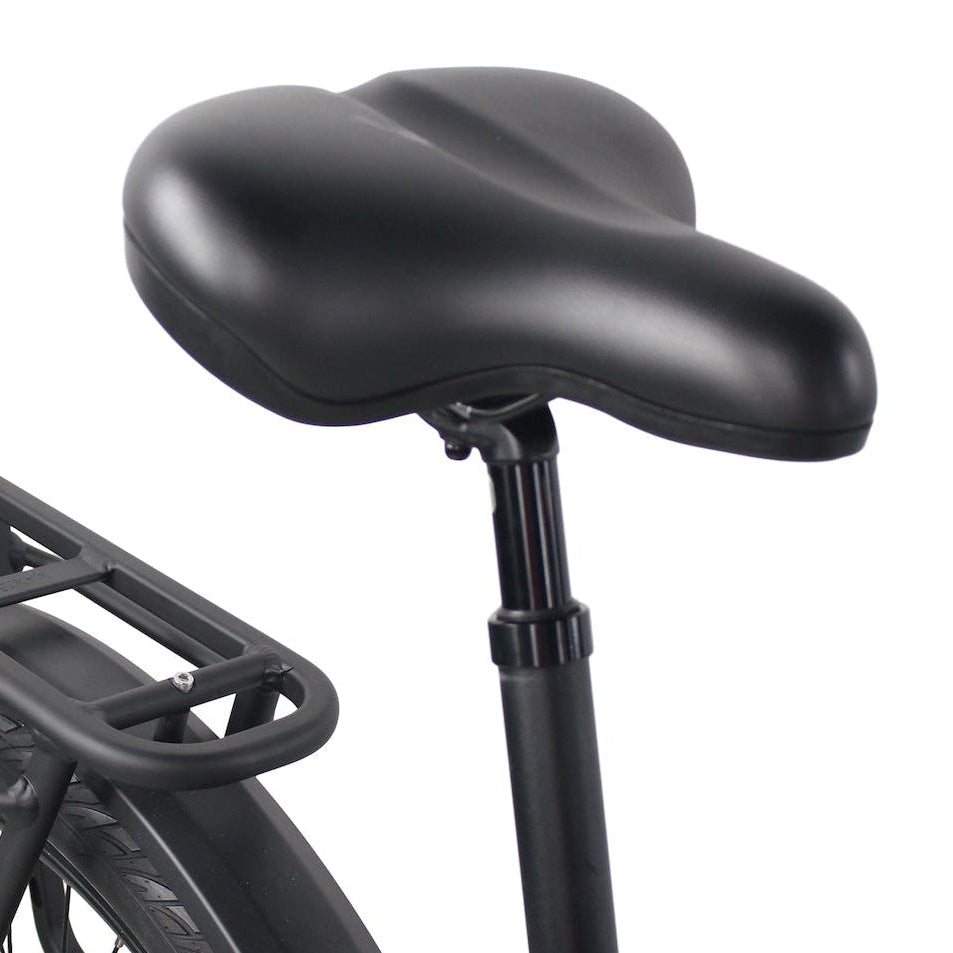 A black bicycle saddle mounted on an adjustable seat post next to a rear luggage rack.