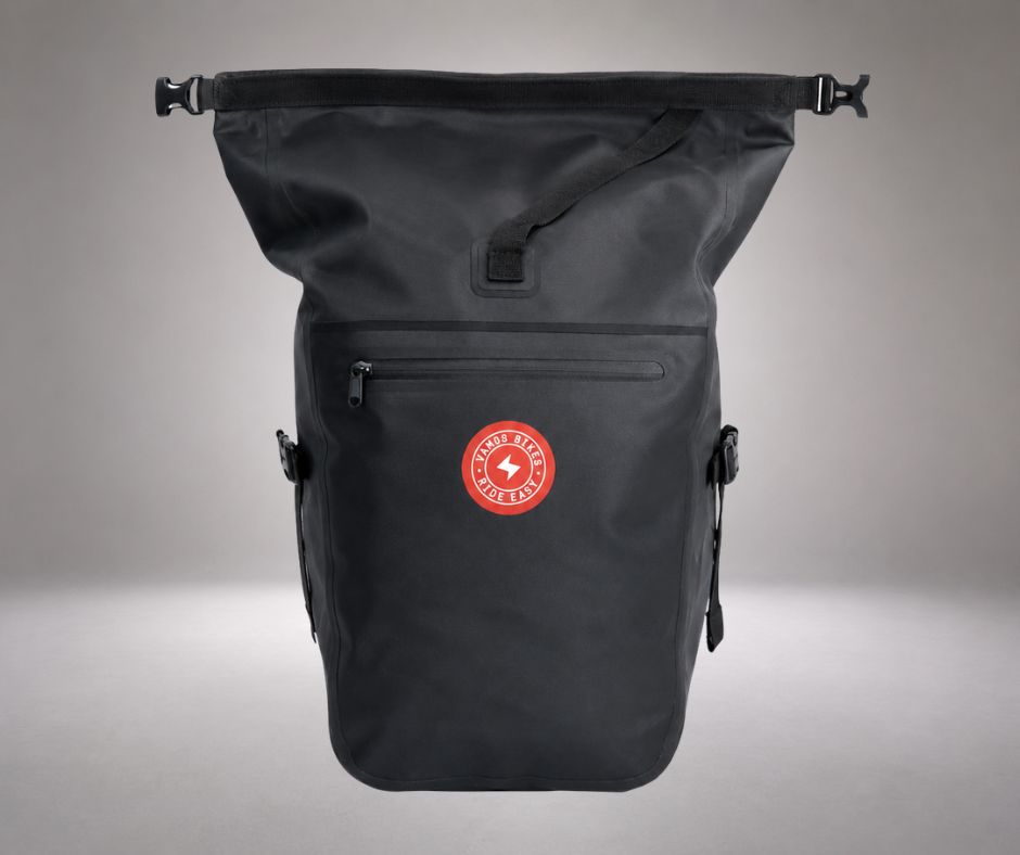 Vamos Waterproof Pannier Bag for Bike with Quick Release Mount featuring a black roll-top design and red circular logo on the front pocket.