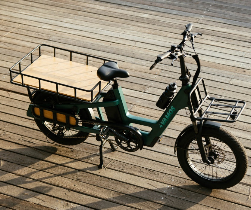 A dark green Vamos Amigo Plus electric commuter bike
