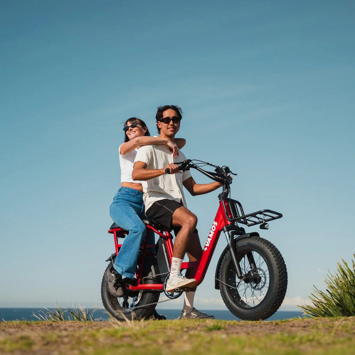 A man and a woman riding a Doblez 2026 Foldable EBike
