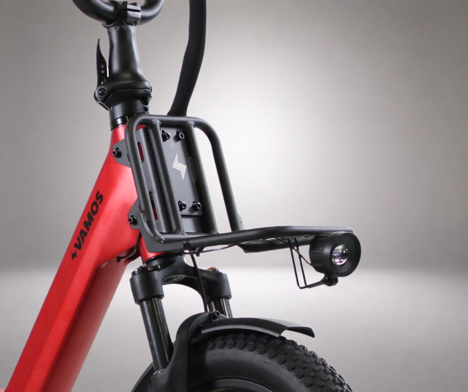 Front rack mounted on a Vamos Doblez 2026 folding electric bike.