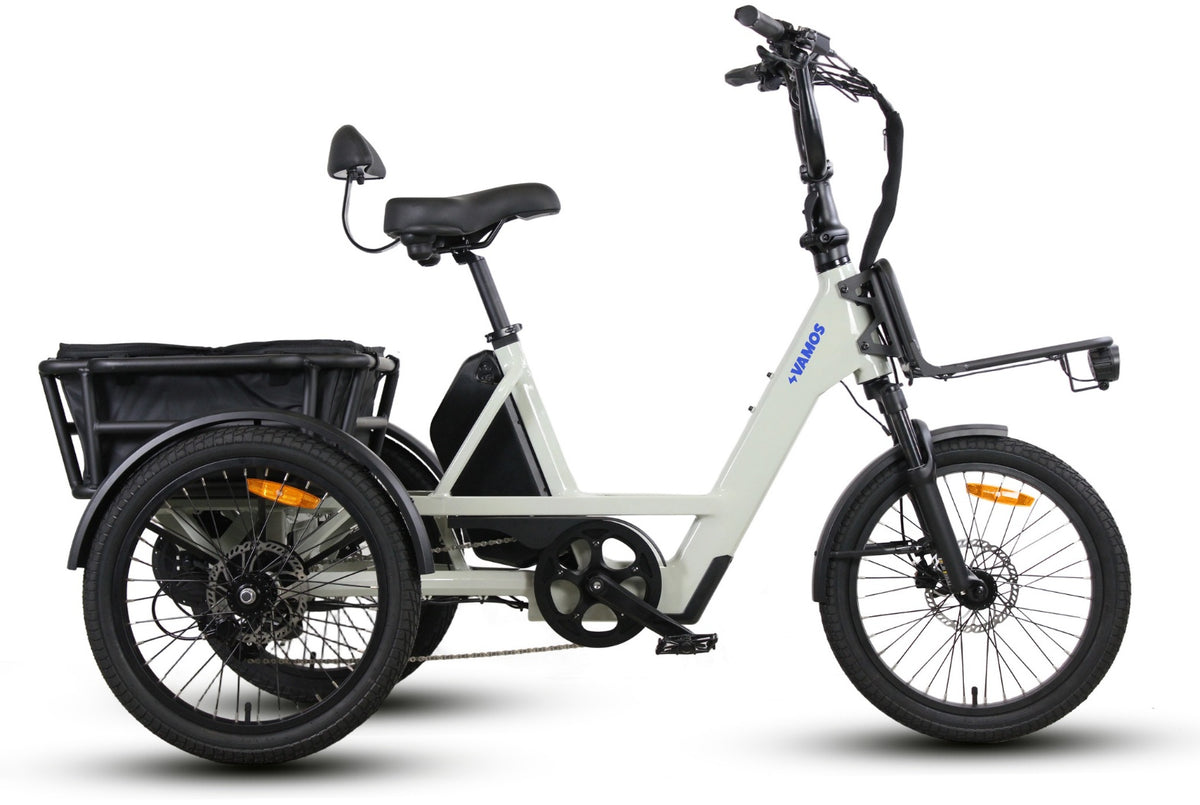 Vamos Trio 3-Wheel Electric Trike, a compact cargo tricycle featuring a white step-through frame and a rear storage basket.