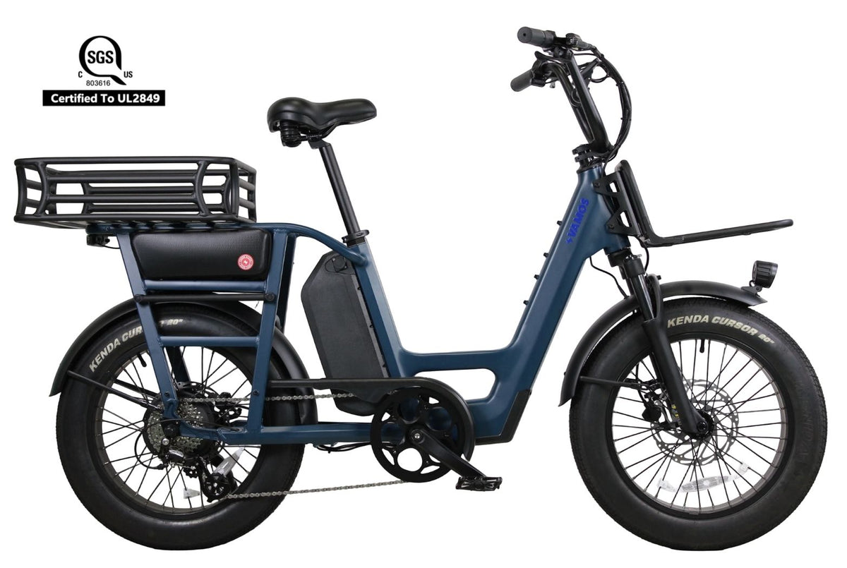 Vamos Amigo 2026 All-Purpose Compact Cargo E-Bikefinished in blue with chunky Kenda fat tires and a rear cargo rack.
