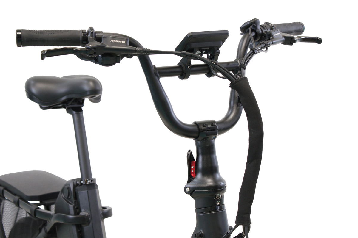 The handlebars, display, and saddle area of a Vamos Doblez 2026 Foldable E-Bike, resembling an urban folding e-bike or moped-style fat tire e-bike.
