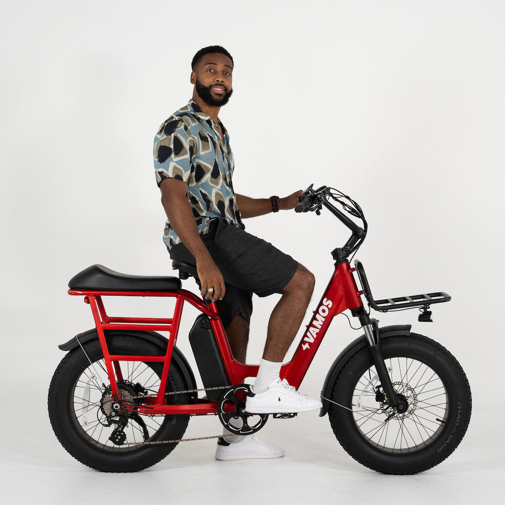 A man in 5”9 / 178cm size riding a Vamos El Amigo 2025 All Purpose Compact Cargo Ebike