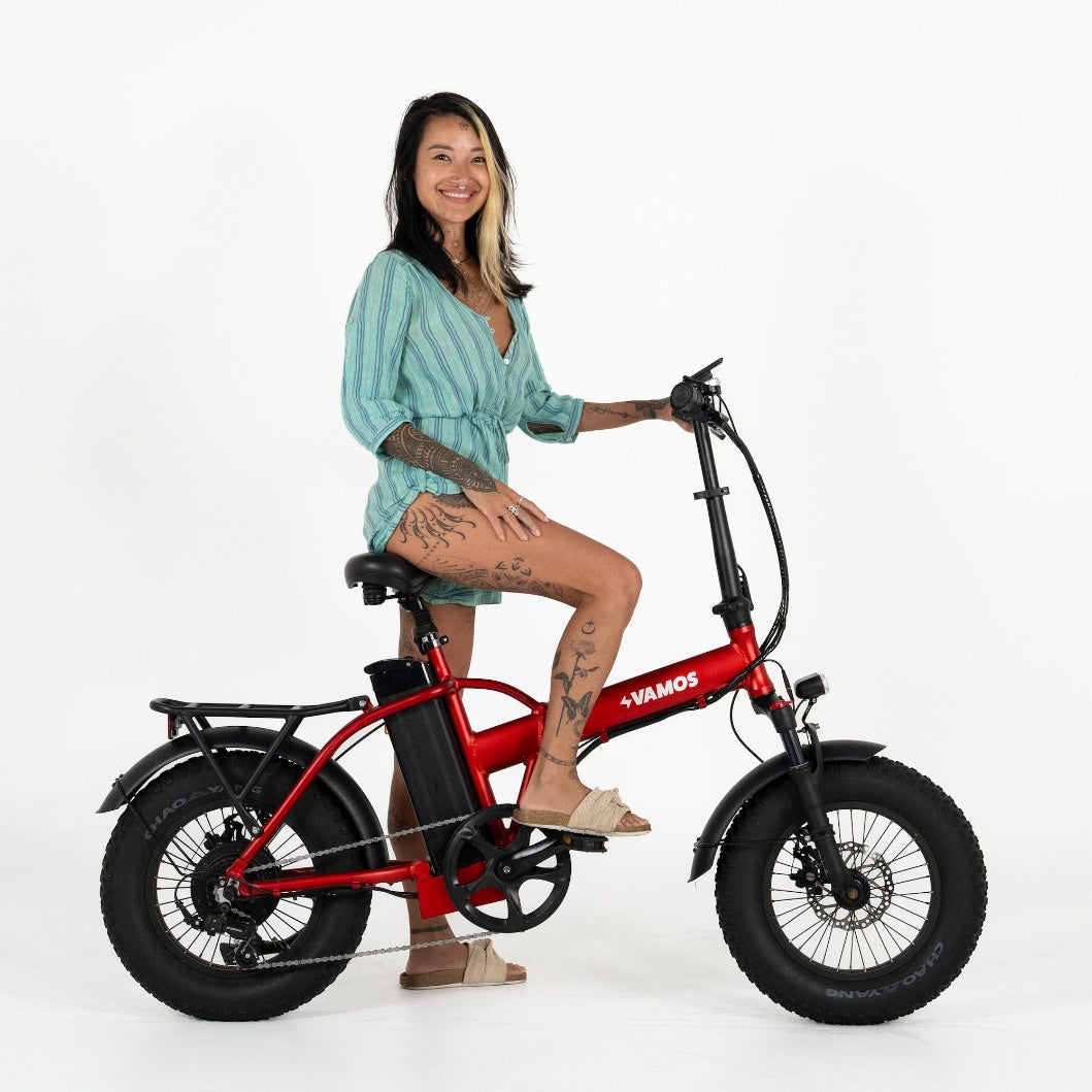 A red Vamos El Doblez folding electric bike with fat tires.