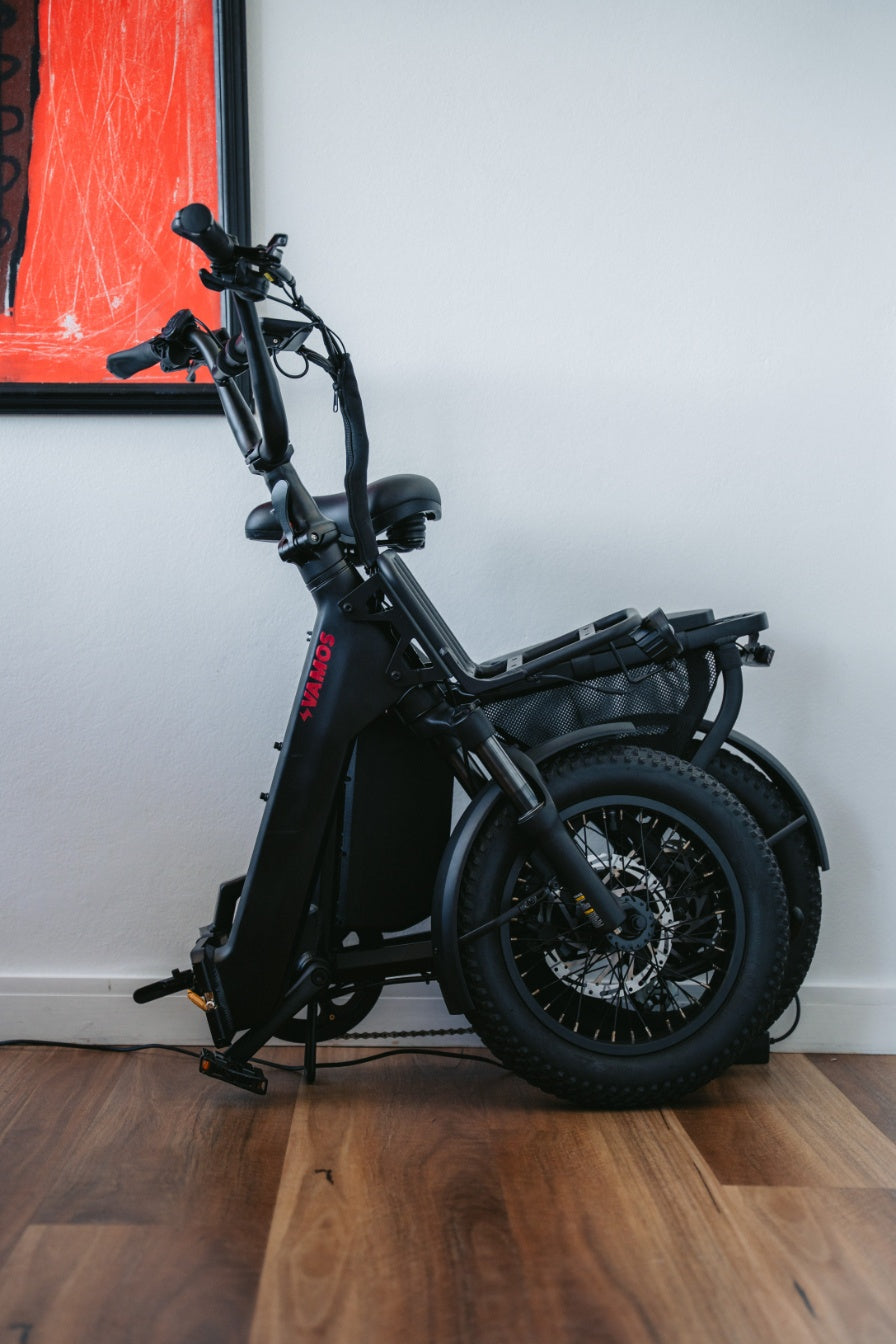 A folded Vamos Doblez 2026 electric bike in black.