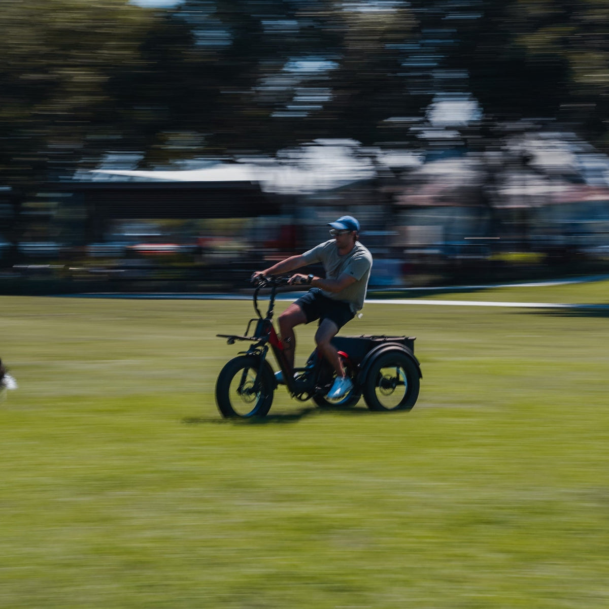 A man riding a Vamos El Papa Grande Pro on a greenfield