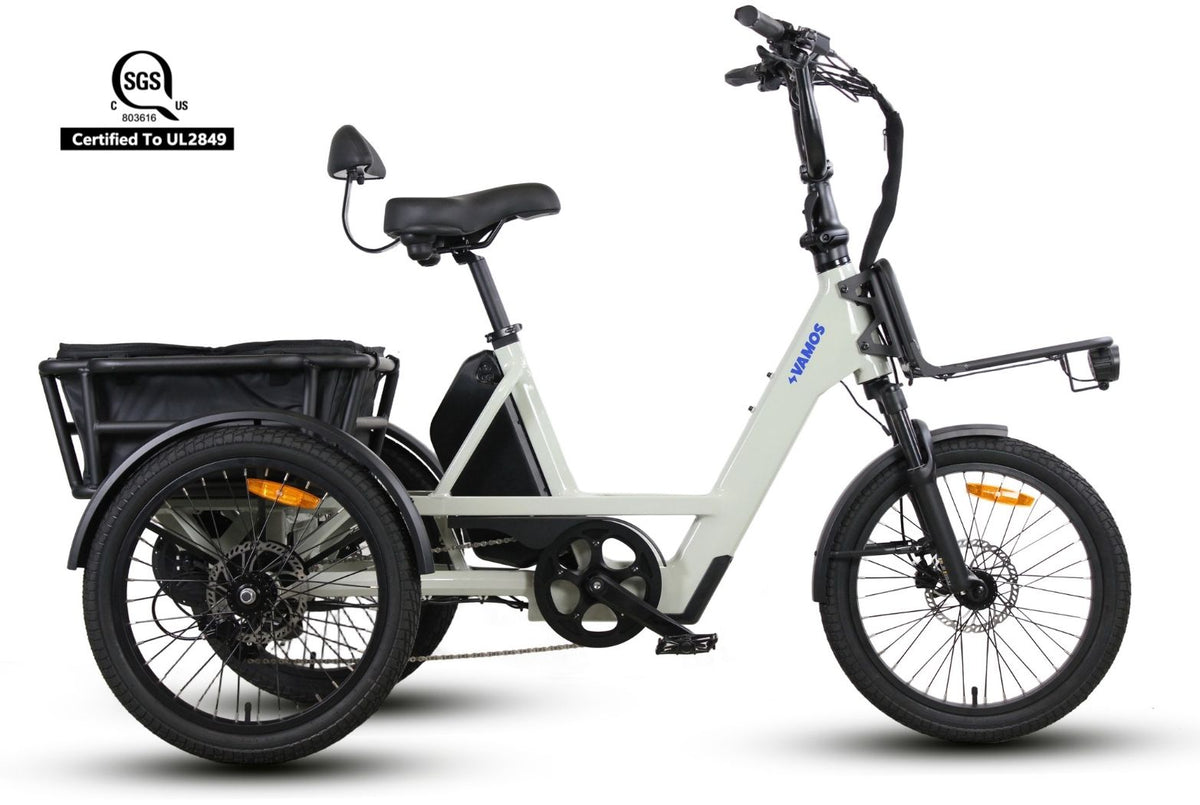 Vamos Trio, a 3-wheel electric cargo tricycle featuring a low step-through frame, a rear storage basket, and front and rear hydraulic disc brakes