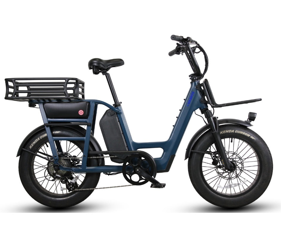 A blue Vamos Amigo 2026 All-Purpose Compact Cargo E-Bike featuring fat tires, front and rear racks, and a step-through frame
